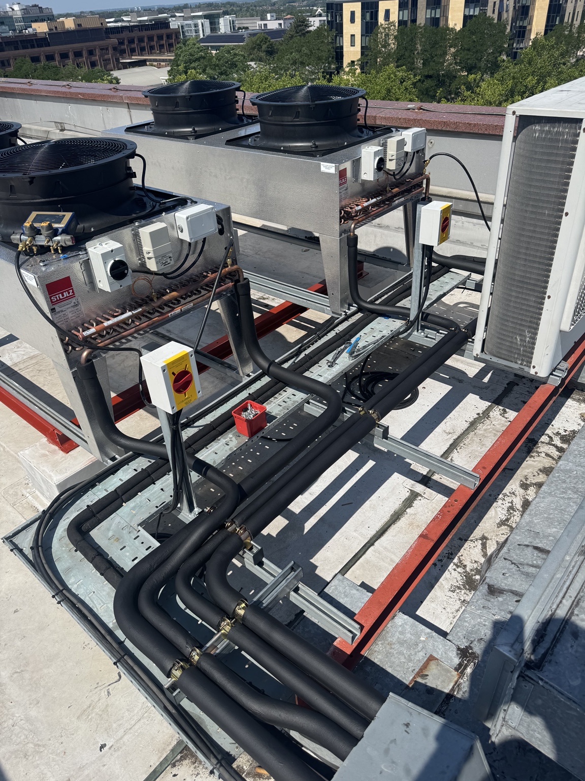 STULZ rooftop close-control cooling plant with insulated refrigeration pipework