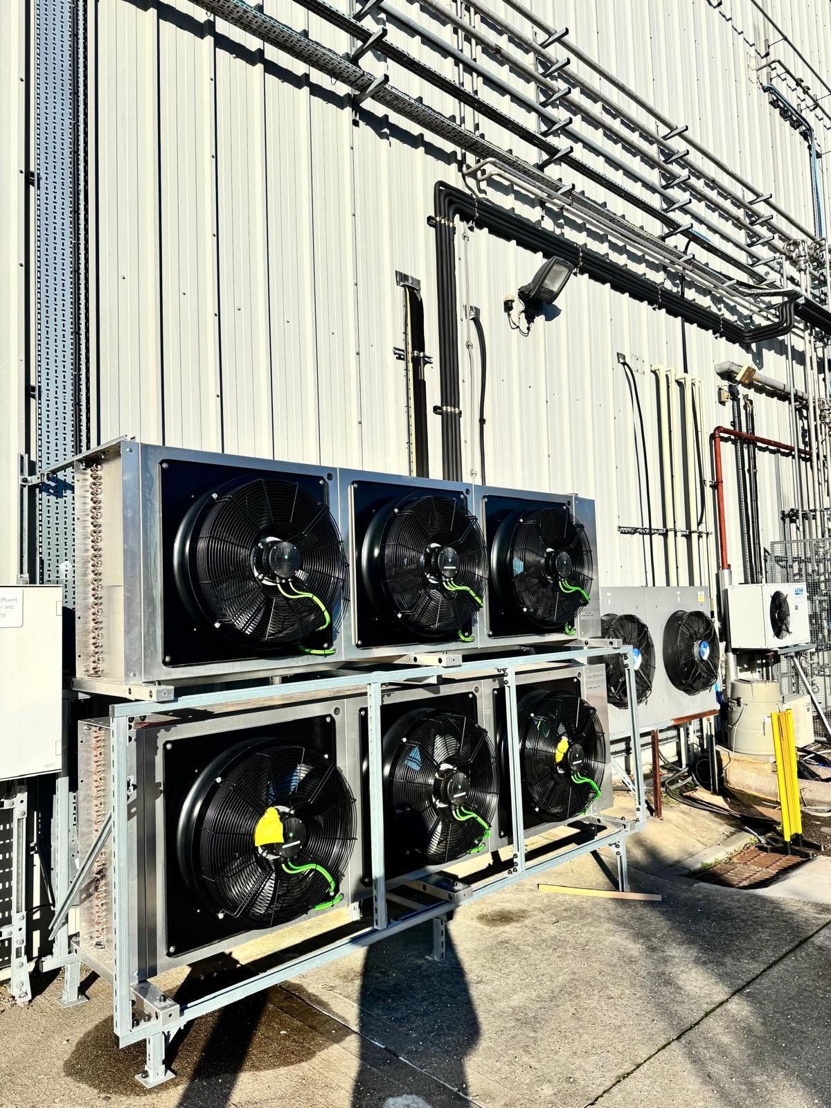 Stacked STULZ condenser units installed on external steel supports